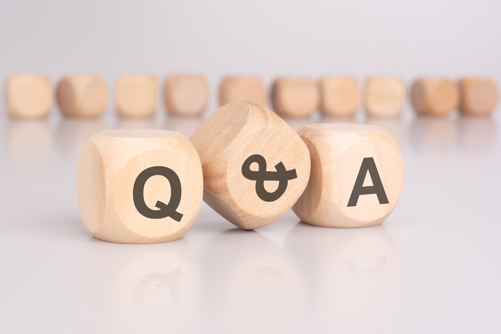 FAQ concept image with wooden blocks symbolizing common questions about microneedling treatment