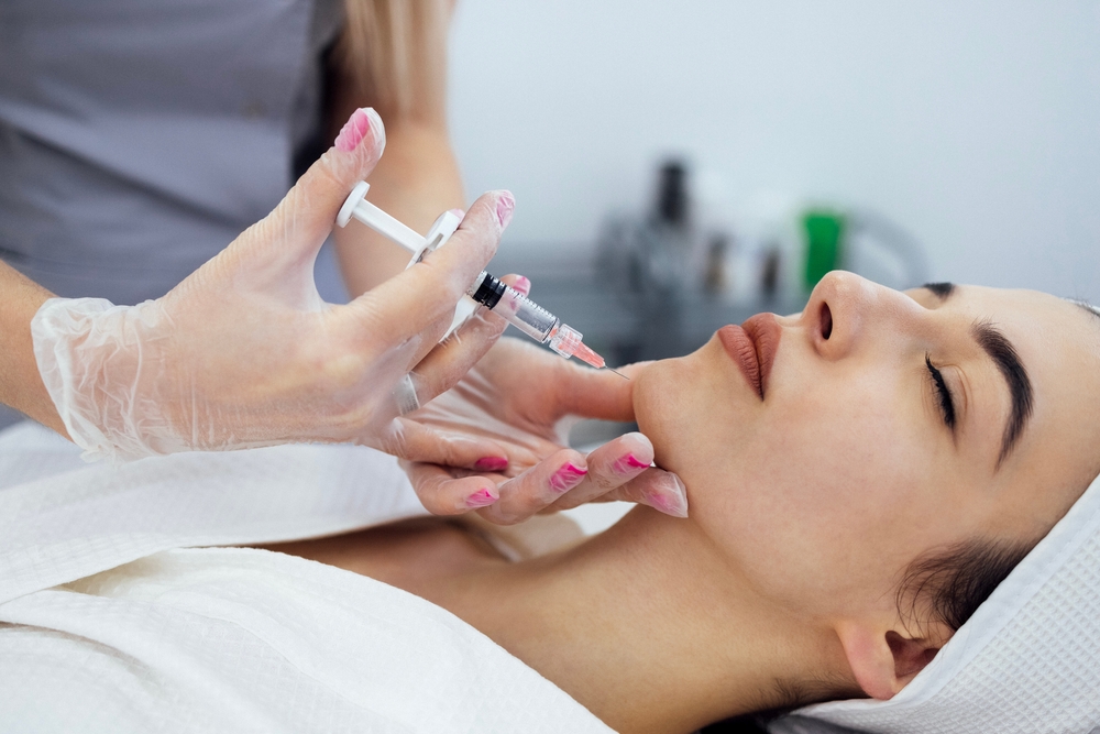 A view of the procedure where Botox is injected into the tip of the chin.